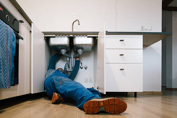 Professional Drain Cleaning technician working in Fate, TX